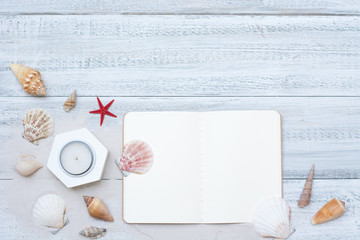 Background with sea shells and notebook