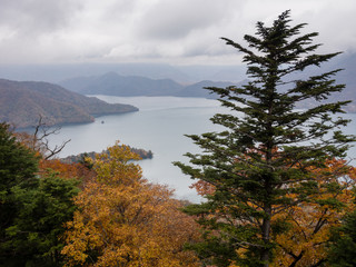 Fall colors in Nikko national park, Japan - view of Lake Chuzenji from a mountaintop overlook