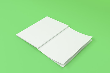 Mockup of blank white open brochure lying with cover upside on green background