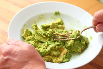 Mashing an avocado