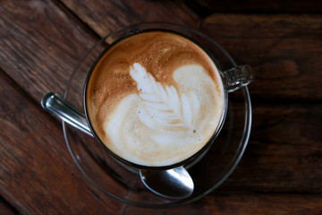 Latte with leaf frothy foam