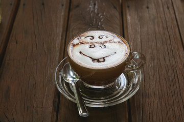 Cup of mocca coffee on wooden table