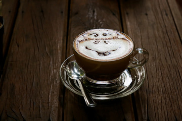 Cup of mocca coffee on wooden table