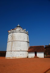 The lighthouse of the Aguada Fort in Candolim, Goa, India overlooking the Arabian Sea