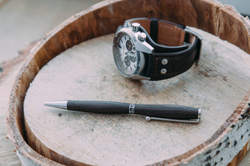 Fototapeta premium Exclusive pen on wood background