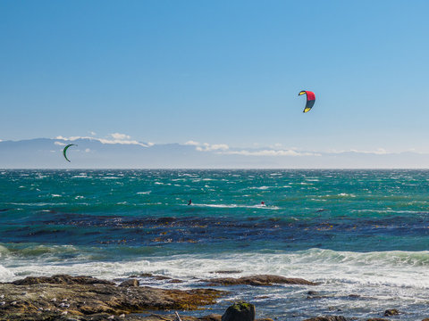 Kite surfers in action on a windy day