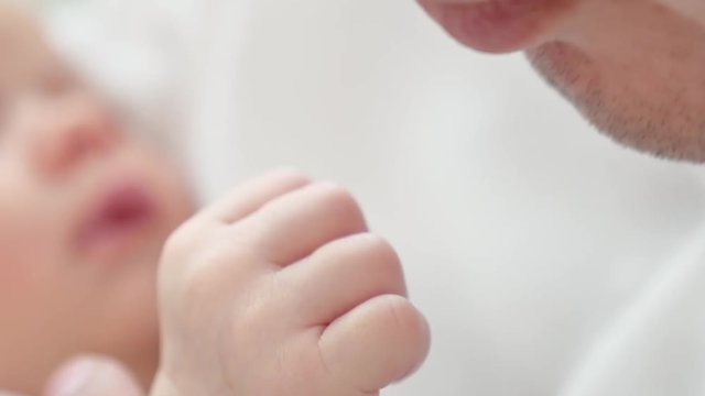 Pope kisses hand of baby, closeup