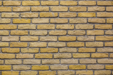 The wall is decorated as a brickwork. Texture of a brick wall as an interior decoration.