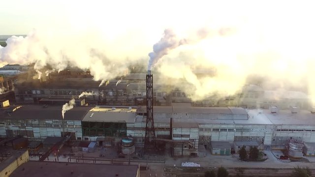 Drone aerial fly above chemical factory smoke.