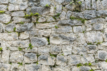 Old grungy gray stone wall texture