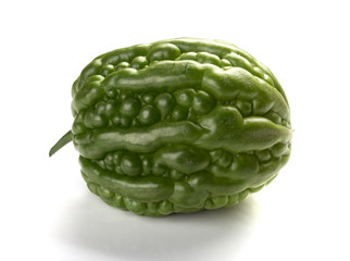 side view fresh green bitter melon on a white background