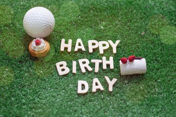 Happy birthday alphabet with golf ball are on green course