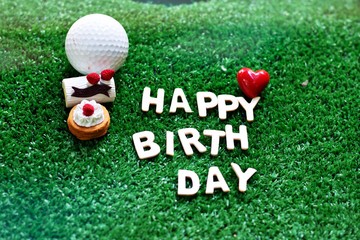 Happy birthday alphabet with golf ball are on green course