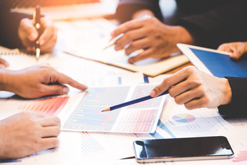 Business partners discussing graph of financial, business concept.  Business Concept. select focus