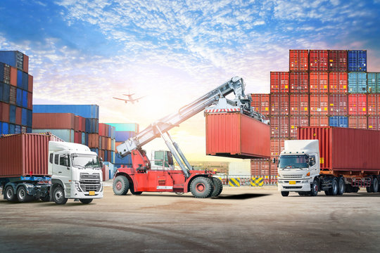Logistics import export background and transport industry of forklift handling container box loading at seaport