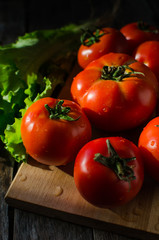 Ripe tomatoes on a cutting Board
