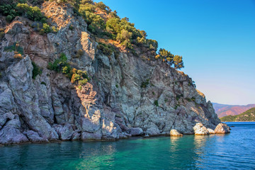 Turquoise water and rocky shore