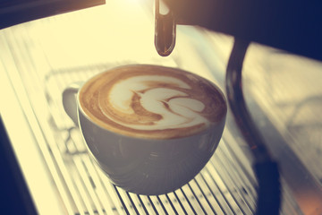 how to make latte art by barista focus in milk and coffee in vintage color