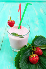 Strawberry-milkshake in a glass on a bright background Dietary menu. Proper nutrition.