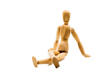 wooden man puppet sitting on white background
