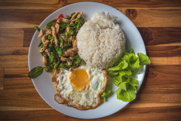 Stir Fried Chicken With Basil Leaf Served With Fried Egg And Cooked Rice