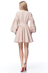 Sexy pretty fashion model blond hair woman wear style for party office clothes organic natural beige dress white background makeup lady perfect body shape shop magazine cover catalog collection.