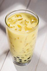 Boba / Bubble tea. Homemade Milk Tea with Pearls on wooden table.