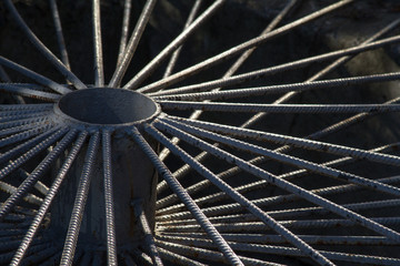 Decorative grid of rebar in the shape of a wheel.