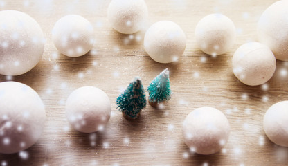 Christmas background with decorations and gift boxes on wooden board