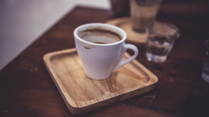Fototapeta na wymiar A White Cup Of Hot Cappuccino Coffee