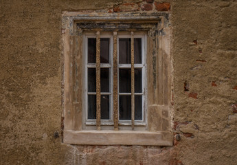 Fototapeta na wymiar The window in wall of an old building