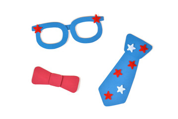 Glasses, tie and bowtie paper cut on white background - isolated
