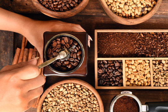 Freshly coffee beans in bowl and coffee beans in coffee grinder for background © nimon_t