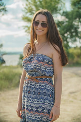 Beautiful romantic girl with a sweet smile on the nature