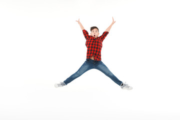 Fototapeta na wymiar Expressive happy boy in jumping