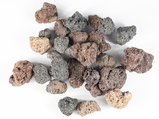 Magma stones over white background from top view