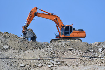 Fototapeta na wymiar Excavating excavators