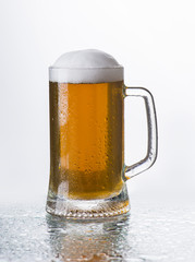 Light beer mug against the backdrop of the bar shelf