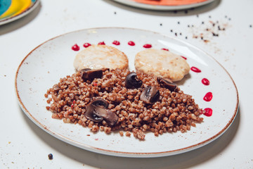 Chicken cutlets with greek croutons and mushrooms for garnish.