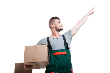 Low angle mover guy holding cardboard box pointing up