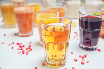 Fresh fruit juice, healthy drinks on white table.