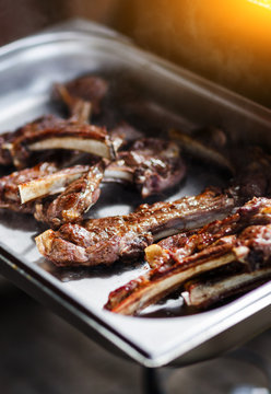 Meat barbecue on iron tray