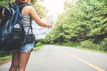 woman  travel. Female travelers travel nature view map on the road