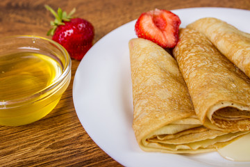 Crepes stack with Strawberry and honey Syrup