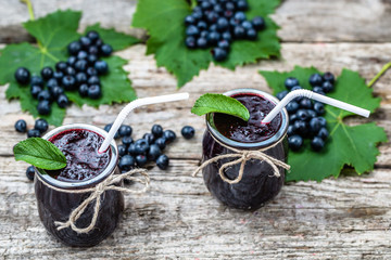 Berry smoothie in jar and fresh blueberry fruits