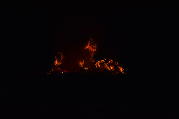 Burning of rice straw at night.