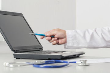 Fototapeta premium Doctor Pointing To The Computer Screen