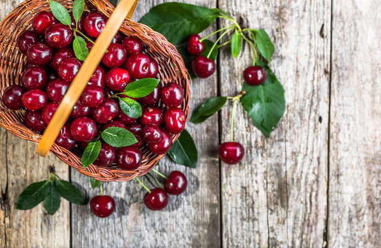 Organic cherries, farm fresh fruits on farmer table