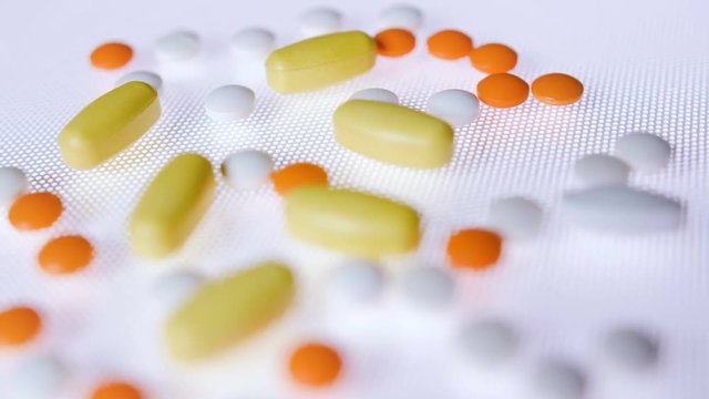 Pills and tablets medicine track shot in 4K. Medical background footage.
Back tracking shot with moving focus.

