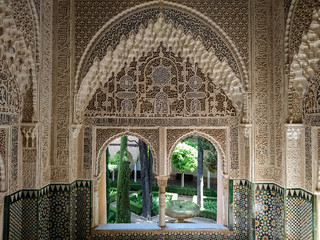 Detail of a wall with arabic symbols and colorful mosaics in the Alhambra - obrazy, fototapety, plakaty
